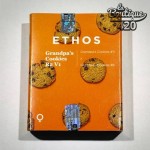 Orangefarbene Verpackung der feminisierten Grandpa's Cookies R2V1-Samen von Ethos Genetics mit Cookie-Abbildungen