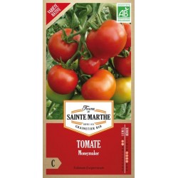 Bio-Samenbeutel Tomate Moneymaker von La Ferme Sainte Marthe mit reifen roten Tomaten an der Pflanze