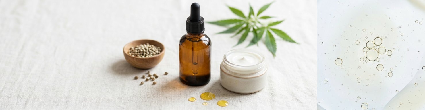 Flacon d'huile, crème cosmétique, graines de chanvre et gouttelettes illustrant les liposomes de lécithine
